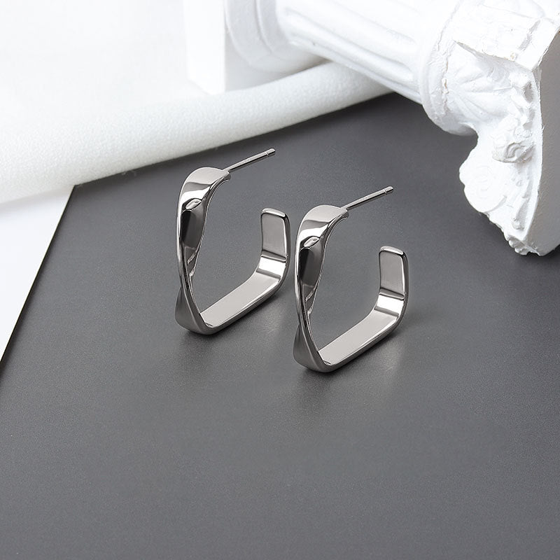 Boucles d'oreilles minimalistes vent froid irrégulièrement tordues