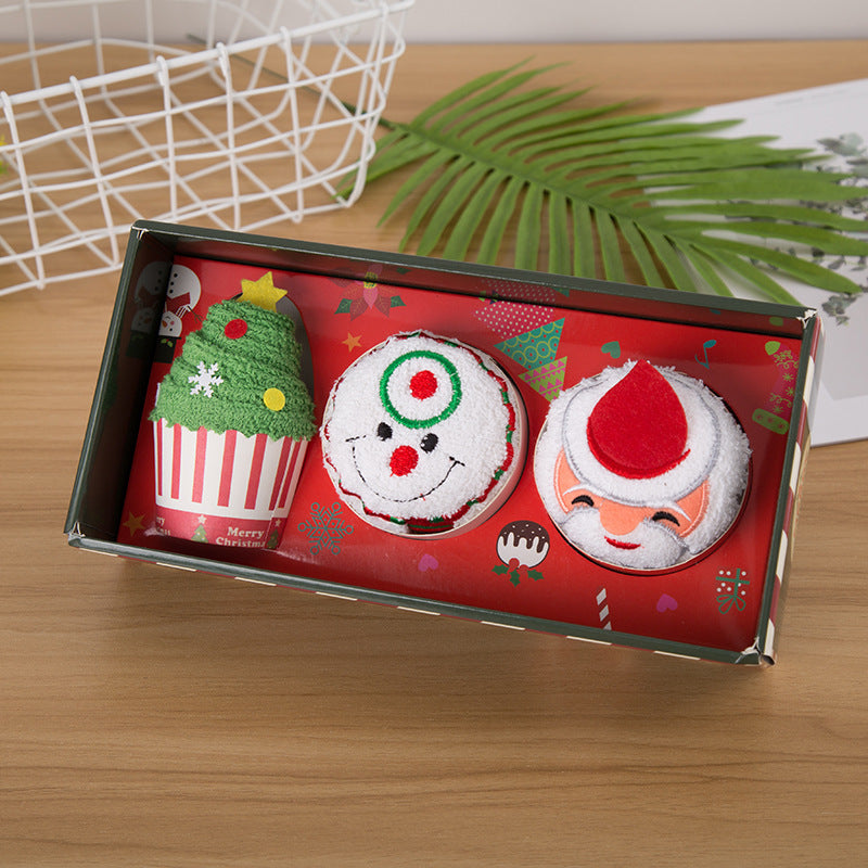 Caja de regalo con muñecos de toalla navideños