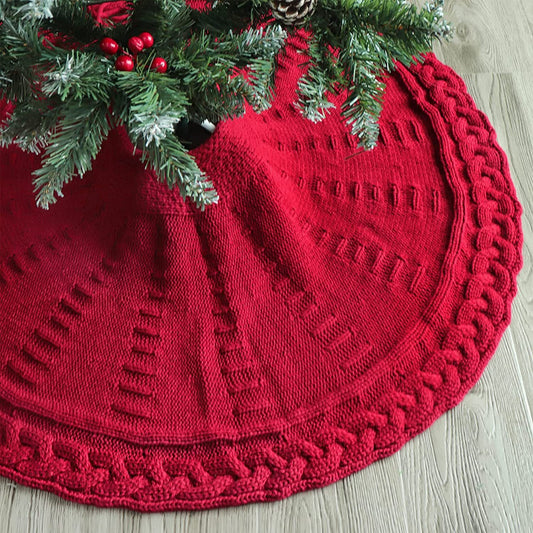 Jupe d'arbre de Noël tricotée avec décorations rouges