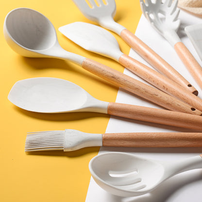 Juego de utensilios de cocina de silicona con mango de madera blanco veteado