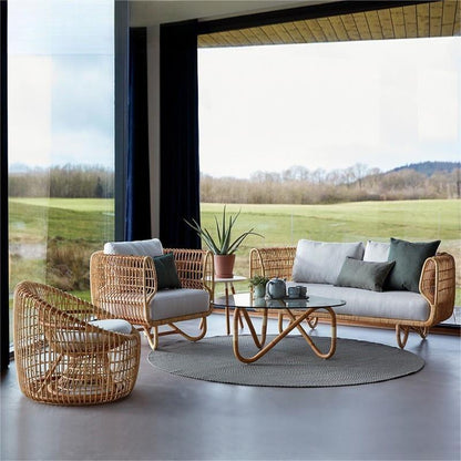 Combinación de mesa de té, silla de ratán tejida, sofá al aire libre