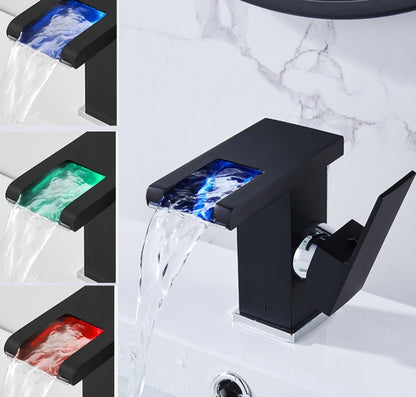 Luminous waterfall faucet in bathroom washbasin