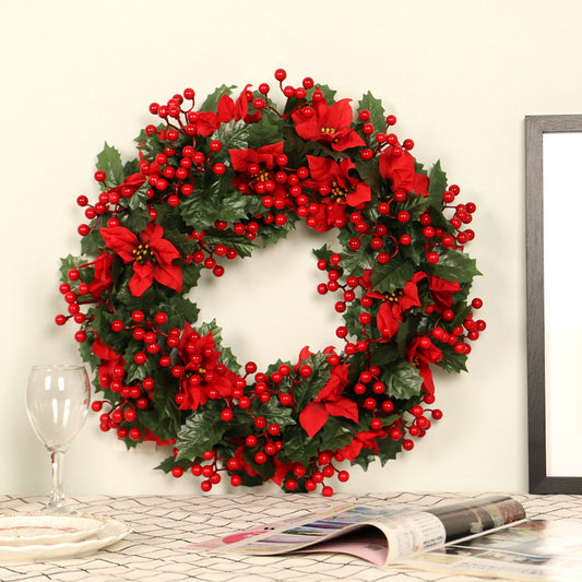 Couronne de Noël rouge avec feuilles de trident vert