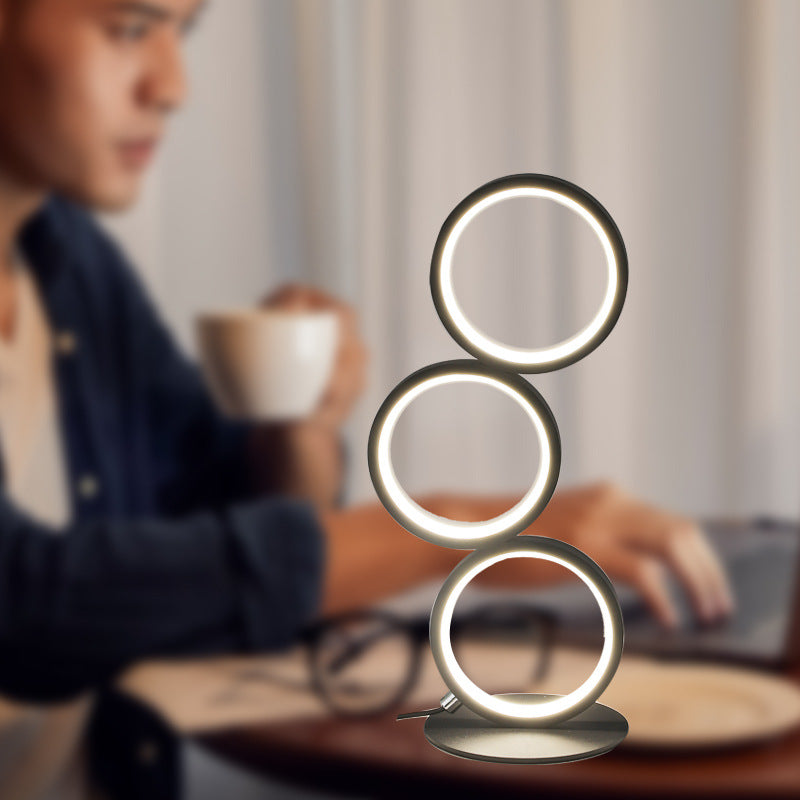 Lámpara de mesa con protección ocular LED con luz de tres tonos y personalidad circular