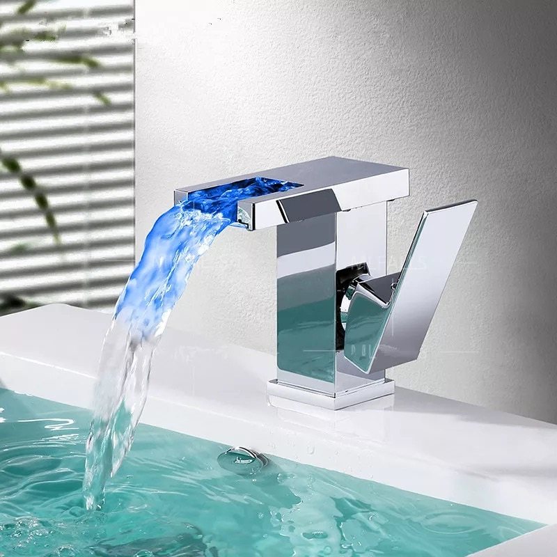 Luminous waterfall faucet in bathroom washbasin