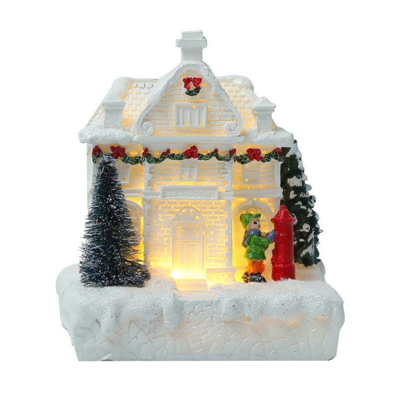 Cabaña de luz blanca cálida con pequeñas casas que emiten luz y decoraciones navideñas