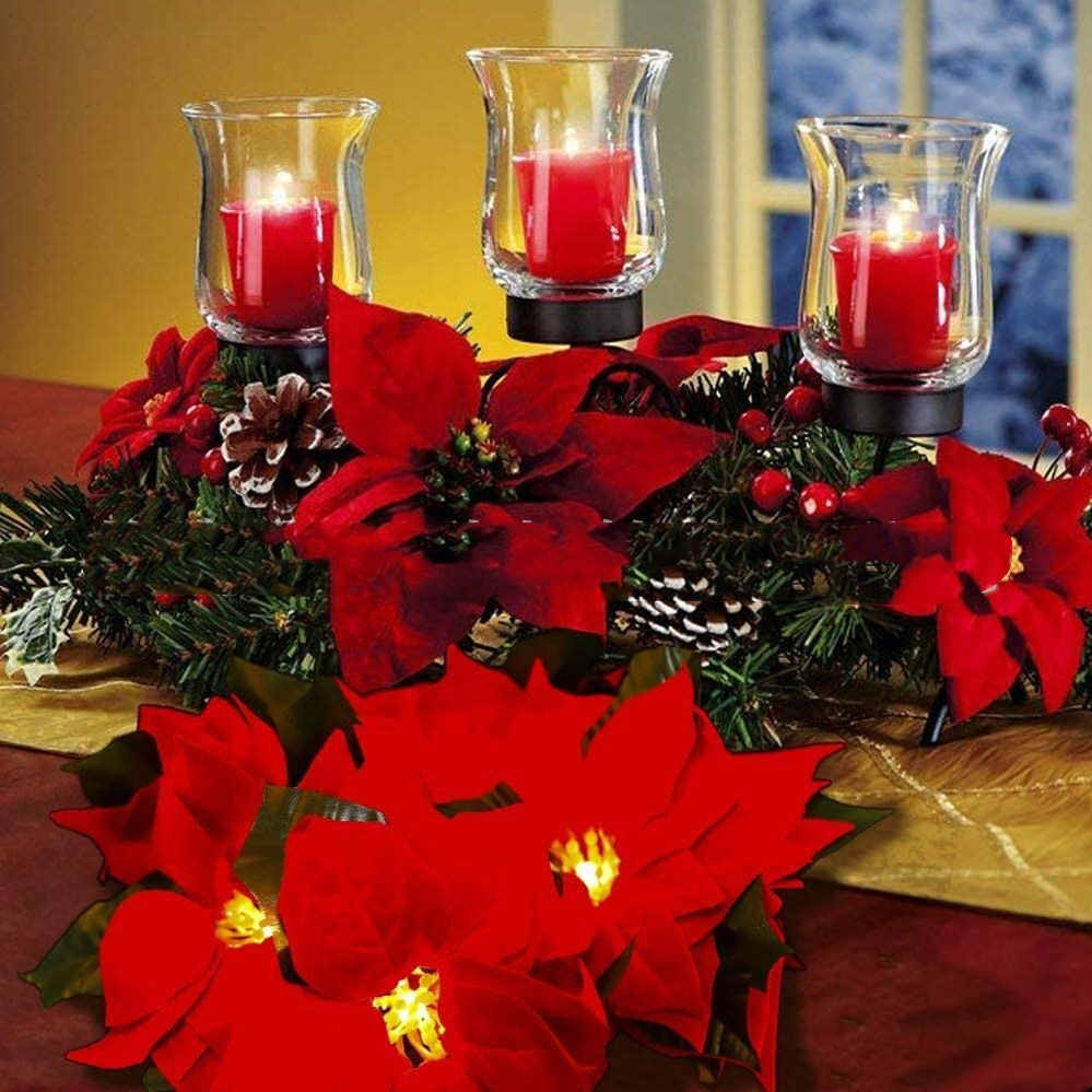 Decoración de escalera mecánica con marco de puerta y luces de cadena de flores rojas