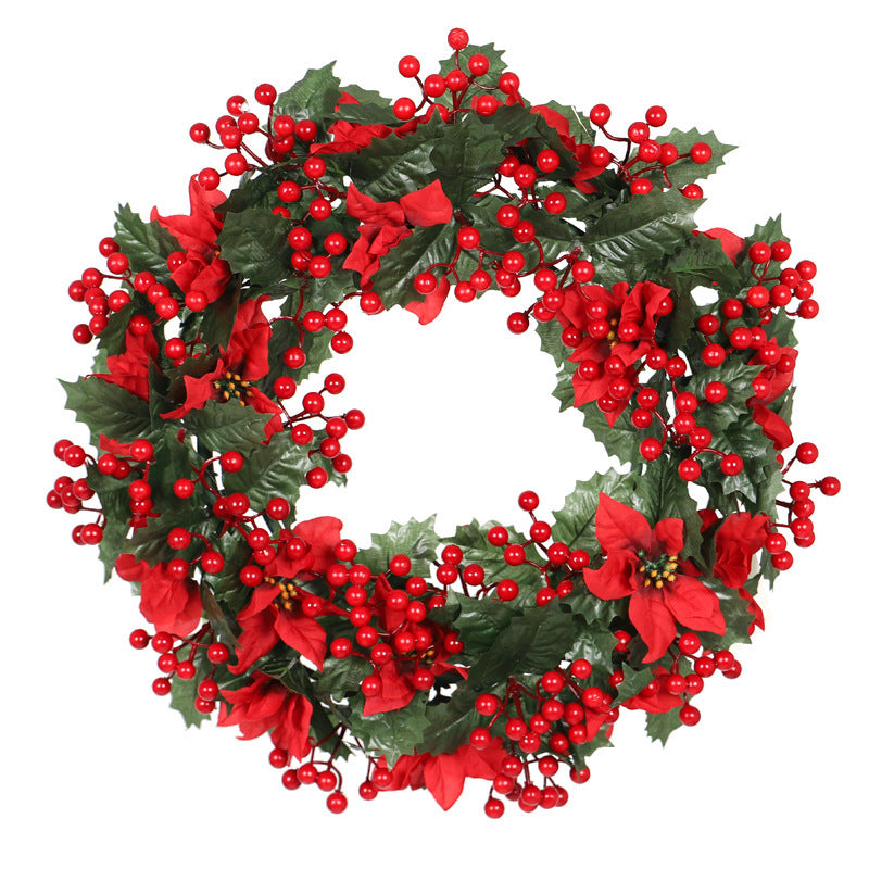 Couronne de Noël rouge avec feuilles de trident vert