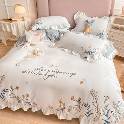 Housse de couette brodée en quatre pièces pour lit en coton lavé